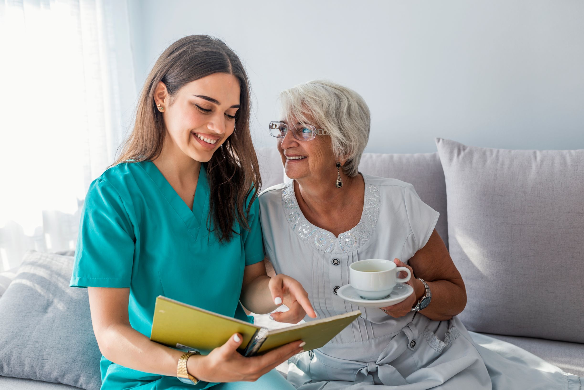 happy-patient-is-holding-caregiver-hand-while-spending-time-together